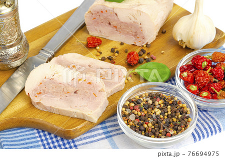 Homemade chicken fillet meat roll with vegetables and spices Homemade chicken fillet meat roll with vegetables and spices 76694975