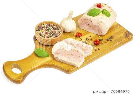 Homemade chicken fillet meat roll with vegetables and spices Homemade chicken fillet meat roll with vegetables and spices 76694976