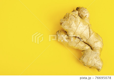 Whole unpeeled ginger root, top view. Photo Whole unpeeled ginger root, top view. Photo 76695078