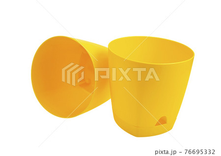 Yellow empty plastic flower pots isolated on white background Yellow empty plastic flower pots isolated on white background 76695332