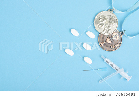 Doping in sport concept. Abuse of anabolic steroids in pills and injections. Pharmaceutical industry. Doping in sport concept. Abuse of anabolic steroids in pills and injections. Pharmaceutical industry. 76695491