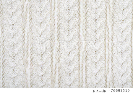 Background knitted fabric, pattern with pigtails. Photo 76695519