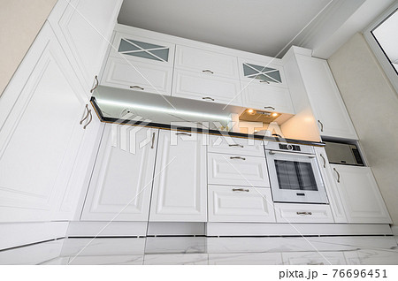 Luxurious white modern kitchen interior Luxurious white modern kitchen interior 76696451