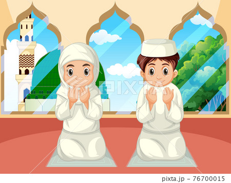Arab muslim boy and girl praying in traditional clothing in mosque background 76700015