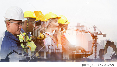 Group of architects and engineers at a building site , Team of expert architects on construciton site in helmets checking workflow Group of architects and engineers at a building site , Team of expert architects on construciton site in helmets checking workflow 76703759