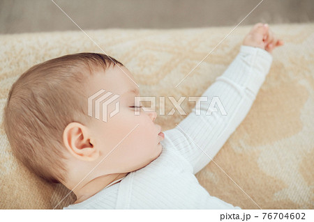 Profile of sleeping cute little baby 76704602