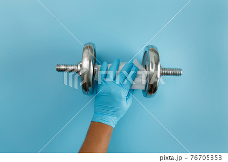 Fitness cleaning gym  Covid 19 virus  alcohol spray anti virus concept Workout from home stay safe 76705353