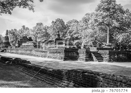 Landmark of old chedi made of ancient bricks in the Kamphaeng Phet Historical Park, Thailand. Black and white 76705774