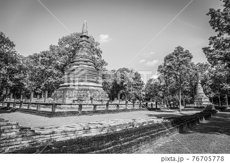 Landmark of old chedi made of ancient bricks in the Kamphaeng Phet Historical Park, Thailand. Black and white Landmark of old chedi made of ancient bricks in the Kamphaeng Phet Historical Park, Thailand. Black and white 76705778