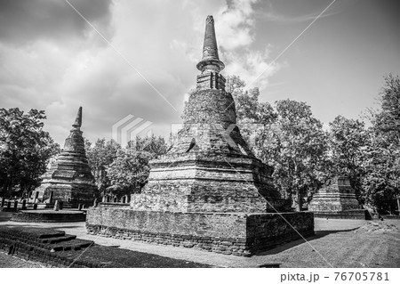 Landmark of old chedi made of ancient bricks in the Kamphaeng Phet Historical Park, Thailand. Black and white Landmark of old chedi made of ancient bricks in the Kamphaeng Phet Historical Park, Thailand. Black and white 76705781