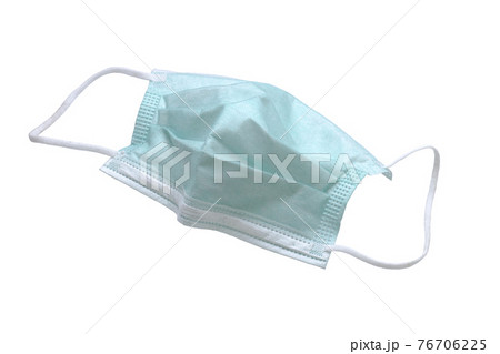 Used green medical surgical mask on white with cliping path. 76706225