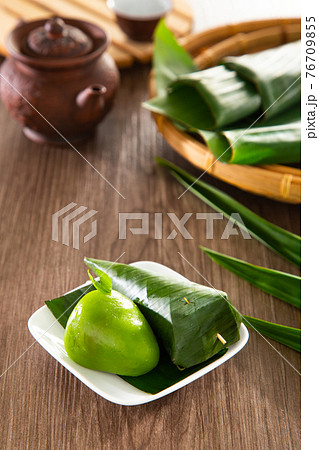 Kuih Koci, traditional Malaysian Nyonya sweet cake. Made from glutinous rice flour with coconut filling, wrapped in banana leaves and steamed. Kuih Koci, traditional Malaysian Nyonya sweet cake. Made from glutinous rice flour with coconut filling, wrapped in banana leaves and steamed. 76709855