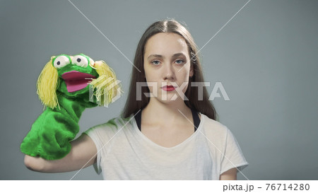Photo of woman with handmade doll on grey 76714280