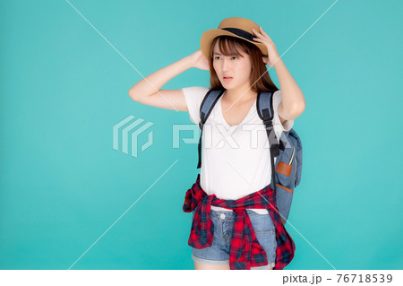 Beautiful young asian woman upset and worry travel summer trip in abroad isolated on blue background Beautiful young asian woman upset and worry travel summer trip in abroad isolated on blue background 76718539