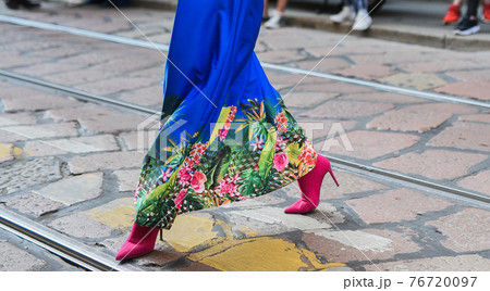 Detail of a fashionable outfit woman wearing colorful dress and pink shoes Detail of a fashionable outfit woman wearing colorful dress and pink shoes 76720097