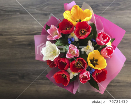 colorful tulip flowers on a table 76721459