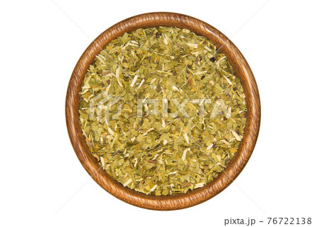 Mate tea on wooden bowl isolated on white 76722138