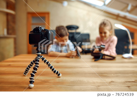 Children bloggers sitting at camera, vlog Children bloggers sitting at camera, vlog 76724539