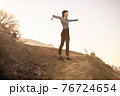 Woman took off her mask in mountains 76724654