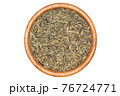 Green tea in wooden bowl isolated 76724771
