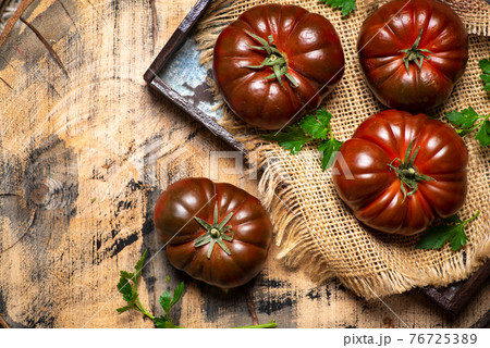 Primora tomato on a rustic wooden table Primora tomato on a rustic wooden table 76725389