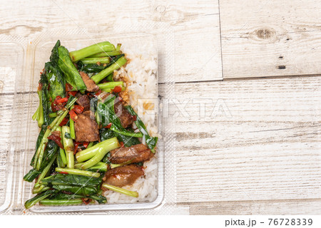 crispy pork belly on topped rice - Asian food style.Asian street food on wooden floor, Thai food 76728339