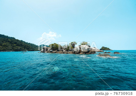 Tropical island and clouds From on the boat Tropical island and clouds From on the boat 76730918