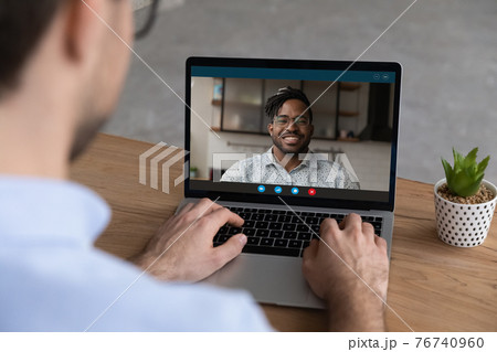 Colleague talk on webcam zoom meeting on laptop 76740960