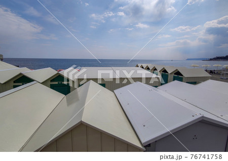 Bathhouse beach club preparation set up for summer season in Italy 76741758