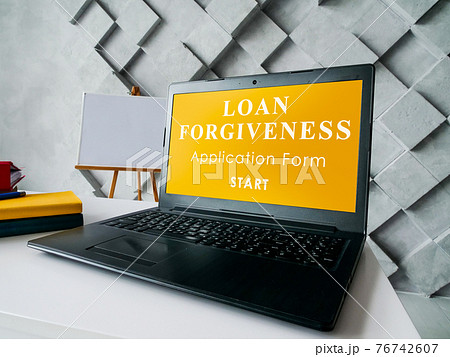 Laptop and open application for loan forgiveness. 76742607