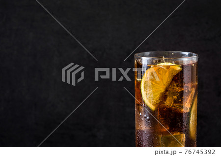 Cuba libre. Cocktail with rum, lime and ice 76745392