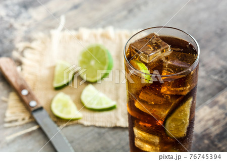 Cuba libre. Cocktail with rum, lime and ice 76745394