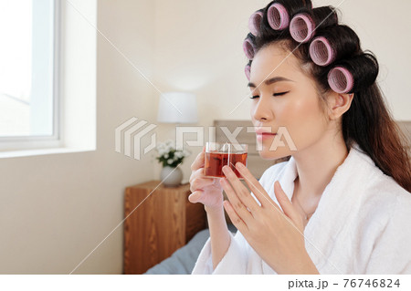 Woman enjoying herbal tea 76746824