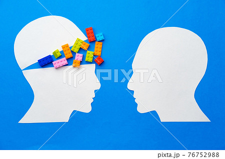 Papercut silhouette of human head with colorful constructor pieces 76752988