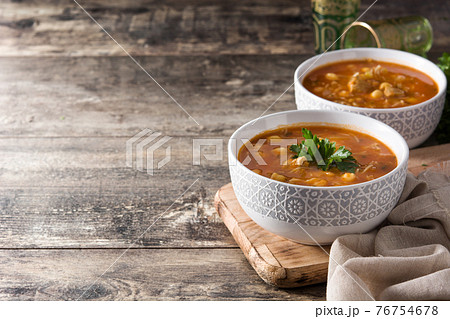 Harira soup in bowl on wooden table 76754678