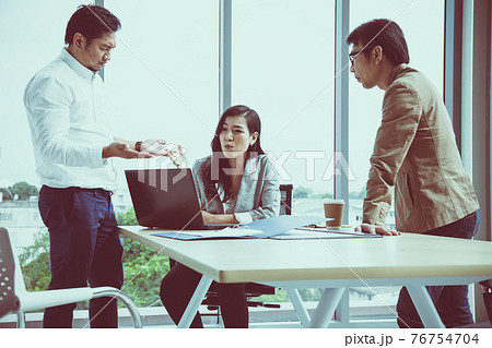 Asian female secretary argue Managing Director and Manager in meeting room 76754704