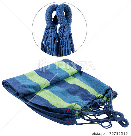 a striped hammock lies on a white background, a rope close-up is presented nearby 76755516