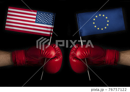 Boxing gloves with European Union and United States flag. USA and the European Union confrontation and relations concept Boxing gloves with European Union and United States flag. USA and the European Union confrontation and relations concept 76757122