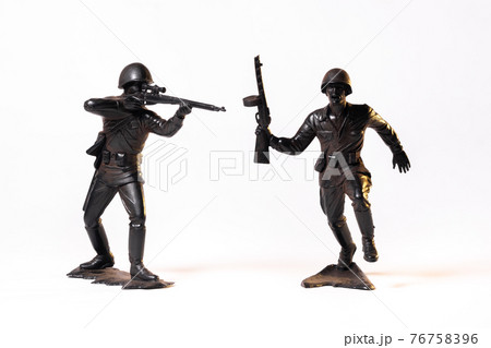 Vintage toy black soldiers isolated on white background Vintage toy black soldiers isolated on white background 76758396