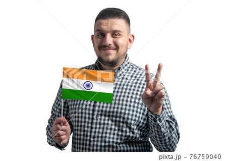 White guy holding a flag of India and shows two fingers isolated on a white background White guy holding a flag of India and shows two fingers isolated on a white background 76759040