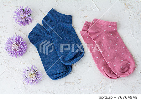 Two pair of women socks on pink background. Two pair of women socks on pink background. 76764948