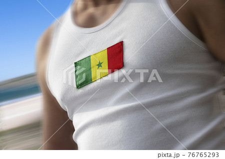 The national flag of Senegal on the athlete's chest The national flag of Senegal on the athlete's chest 76765293