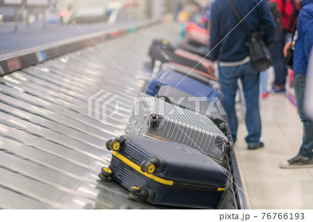 Suitcase or luggage with conveyor belt in the airport 76766193