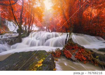 Waterfall scene at Pha Tad Waterfalls in rainforest at the Khuean Srinagarindra National Park Kanchanaburi 76766216
