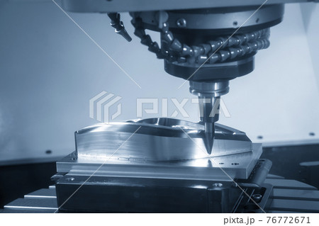 The  CNC  milling machine cutting  the mold parts . The  CNC  milling machine cutting  the mold parts . 76772671