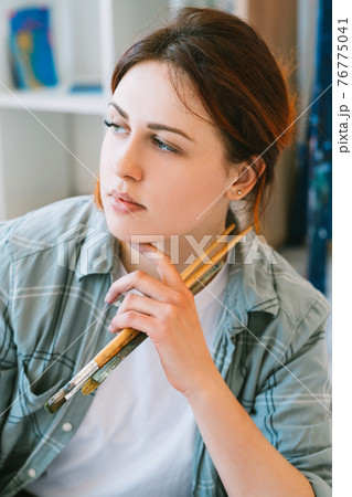 artist portrait inspired woman with paintbrushes artist portrait inspired woman with paintbrushes 76775041