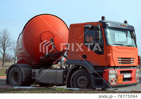 Gasoline tanker red fuel tank. Oil trailer, truck on road 76775094
