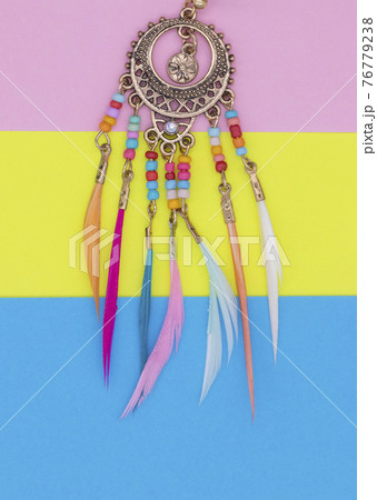 Ethnic decorations on colored sheets of paper. Ethnic decorations on colored sheets of paper. 76779238