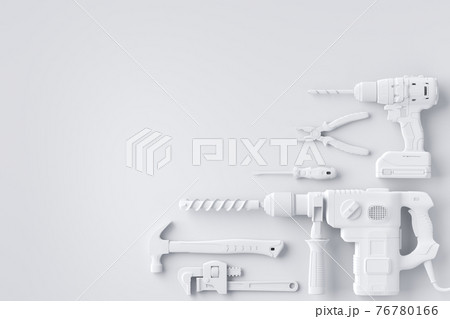 Top view of monochrome construction tools for repair and installation on white 76780166