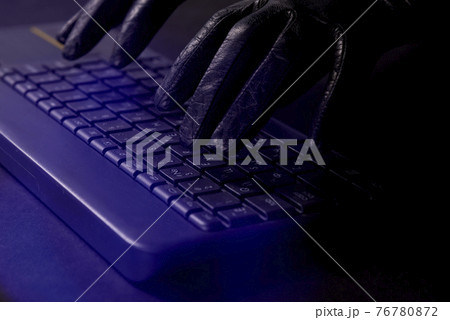 Hacker's hands on laptop keyboard. Hacking a security system. Hacker in gloves 76780872